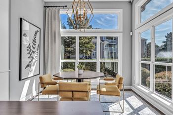 A dining room with large windows